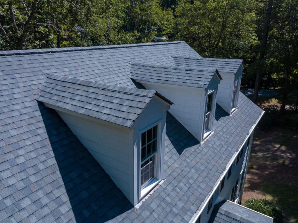 Unique shingle roofing over 3 sets of windows