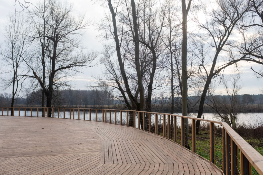 Wood Deck Overlooking Water With Trees